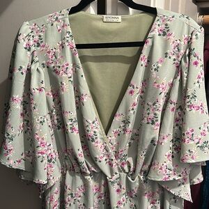 New without tags. Pretty floral print - elastic empire waist - flutter sleeves.